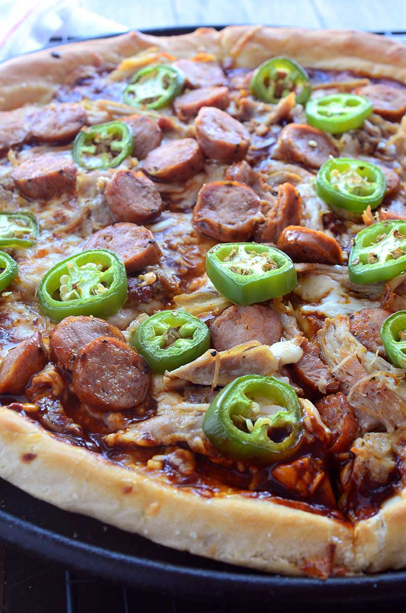 Sweet n' spicy fans will love this pizza! Andouille and BBQ Chicken Pizza is loaded with shredded chicken, andouille sausage, jalapeños and BBQ Sauce.