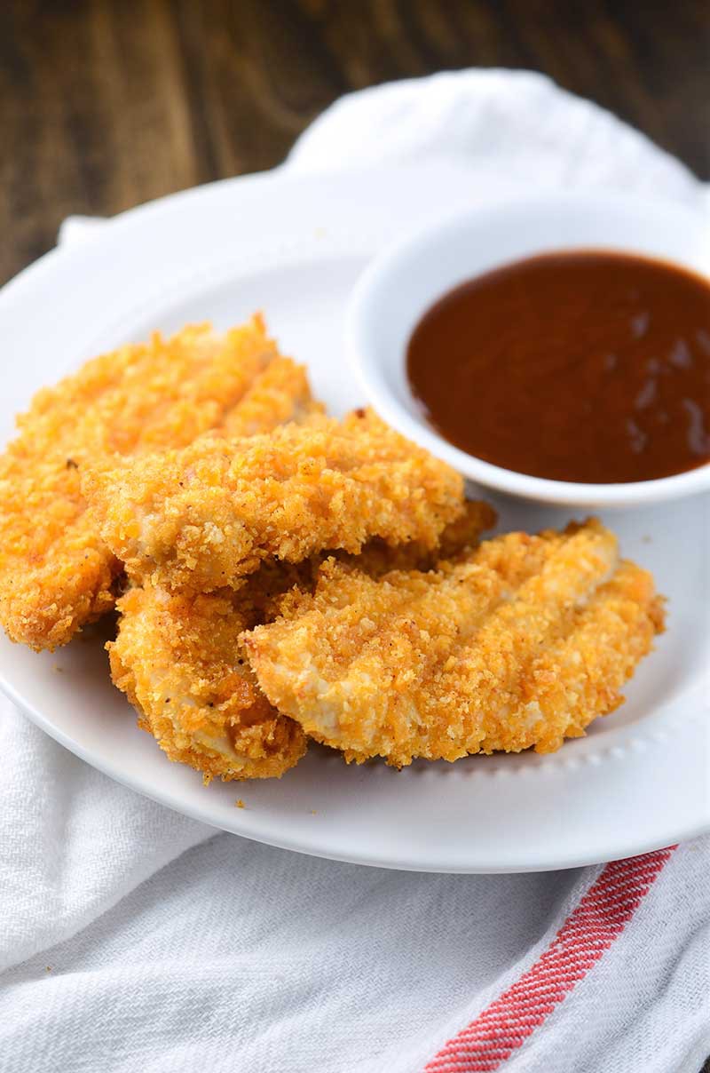 BBQ Chip Crusted Chicken Tenders are chicken tenderloins crusted in BBQ chips and baked until crispy. The perfect kid food!