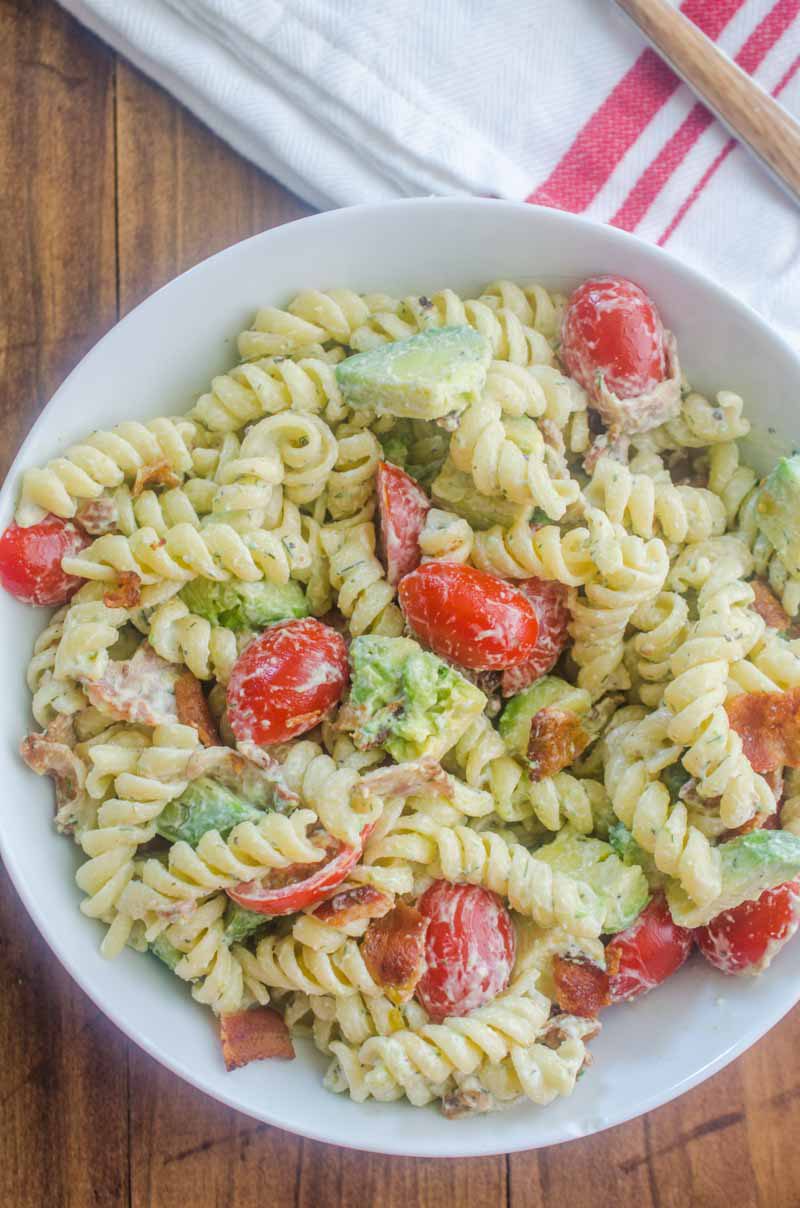 Make all the friends this summer with this Bacon Tomato Avocado Pasta Salad. It's a family favorite with crispy bacon, creamy avocado and sweet summer tomatoes.