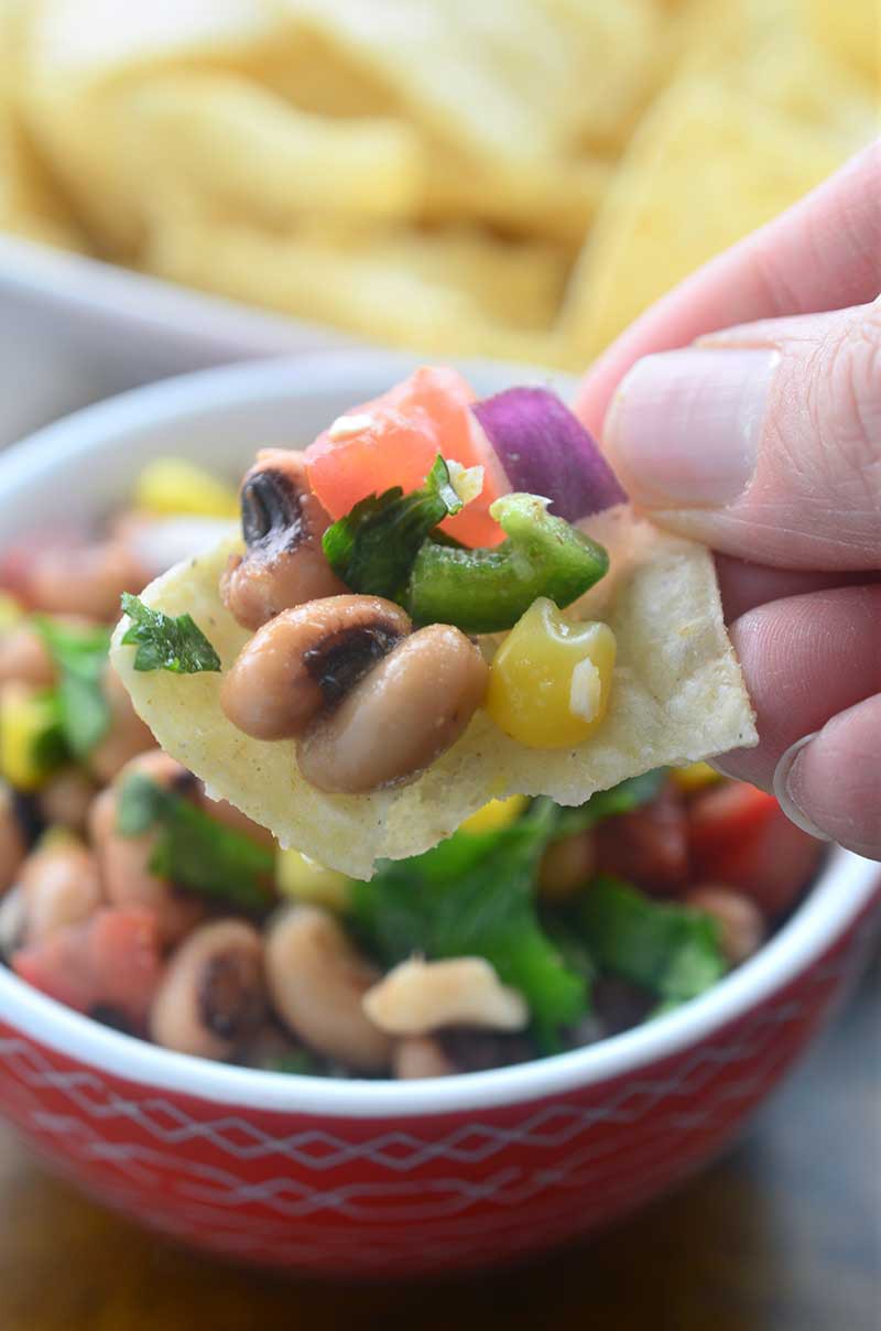 Loaded with black eyed peas, corn, tomatoes, onions, jalapeños, cilantro and lime, black eyed pea salsa is the perfect easy dip recipe to bring a bit of sunshine into your day.