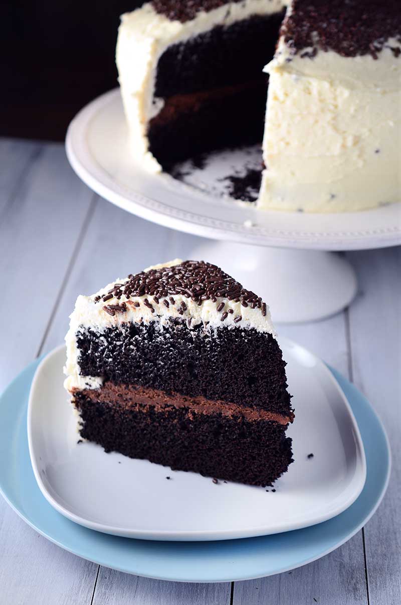 Black and White Chocolate Cake - Decadent chocolate cake with a center of chocolate ganache and topped with white chocolate buttercream frosting.