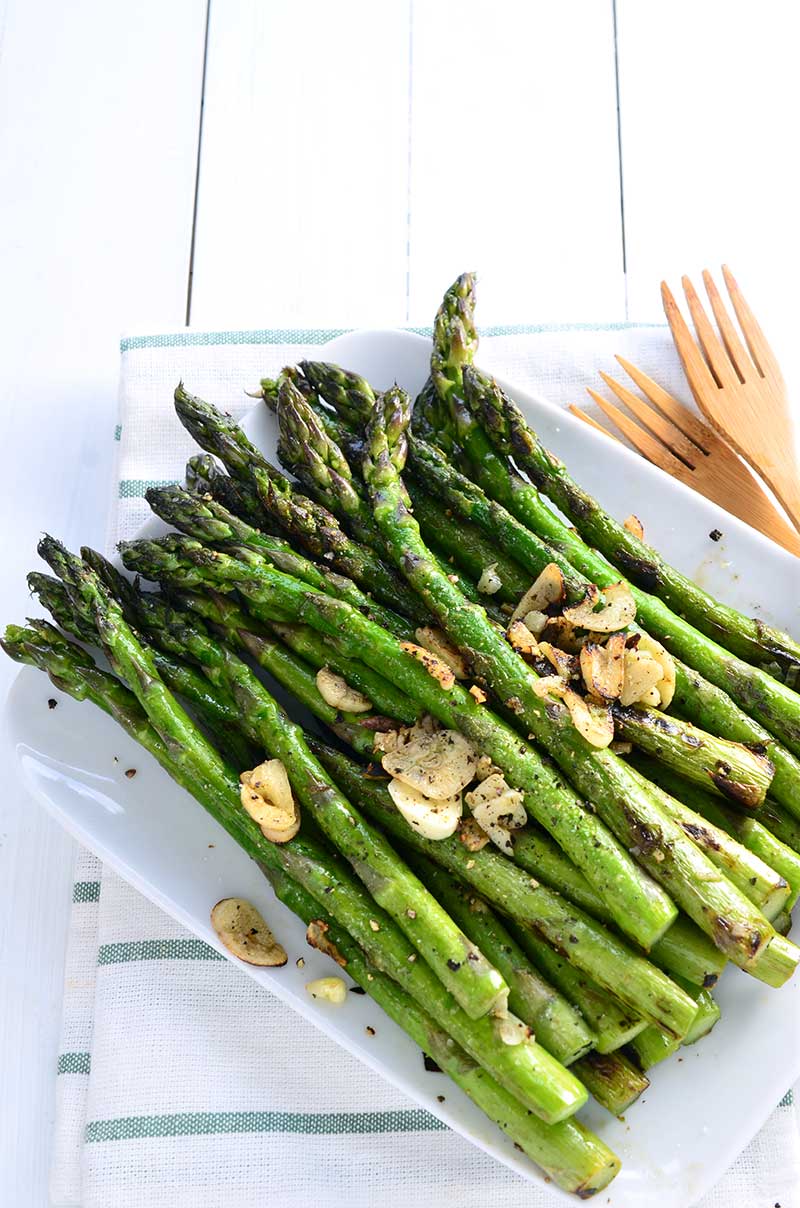 Simple Blistered Asparagus calls for 5 ingredients and is ready in less than 10 minutes. Spring side dish perfection. Gluten free and vegan! 