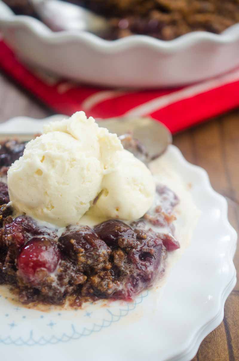 This Cherry Chocolate Chip Cookie Crisp is the perfect way to use summer cherries. Fresh sweet cherries topped with a chocolate chip cookie crumble and baked until bubbly.