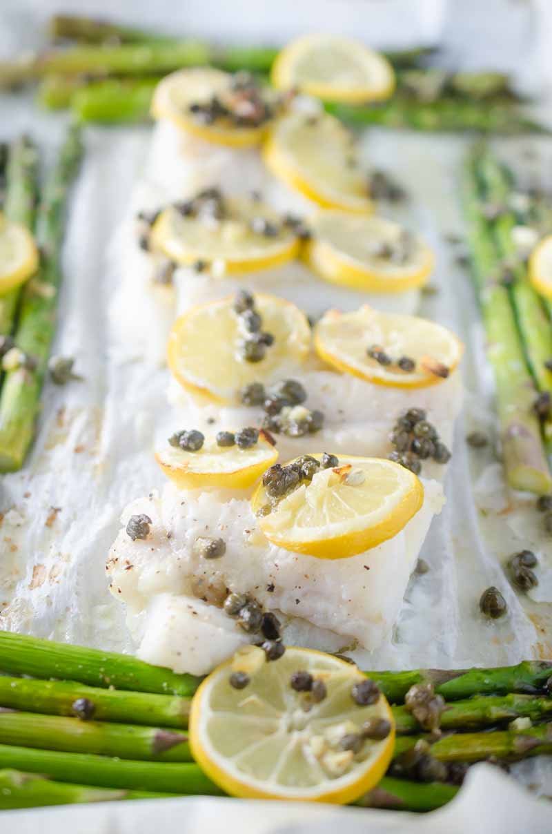 This Cod and Asparagus Sheet Pan Dinner topped with lemons and caper butter just screams easy spring meal!