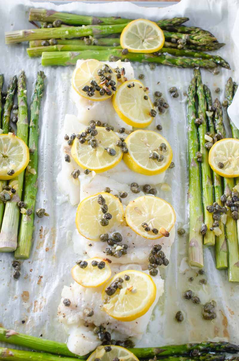 This Cod and Asparagus Sheet Pan Dinner topped with lemons and caper butter just screams easy spring meal!