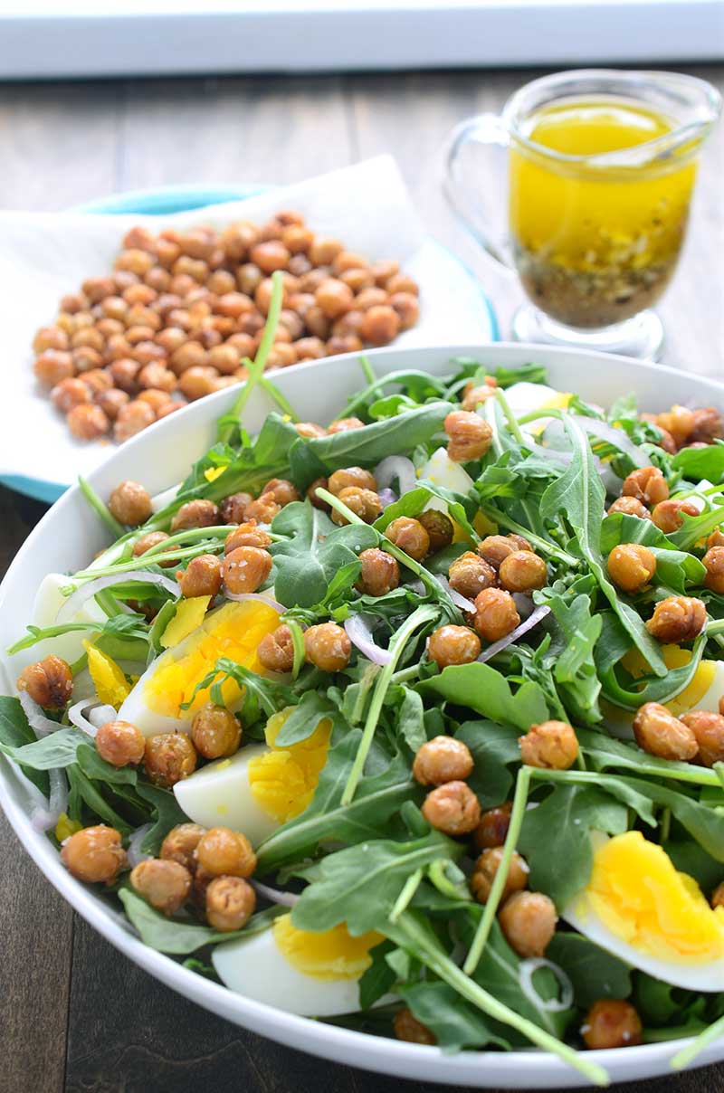 This crispy chickpea and arugula salad is loaded with arugula, crispy fried chickpeas, boiled eggs, shallots and then drizzled with a mustard vinaigrette.