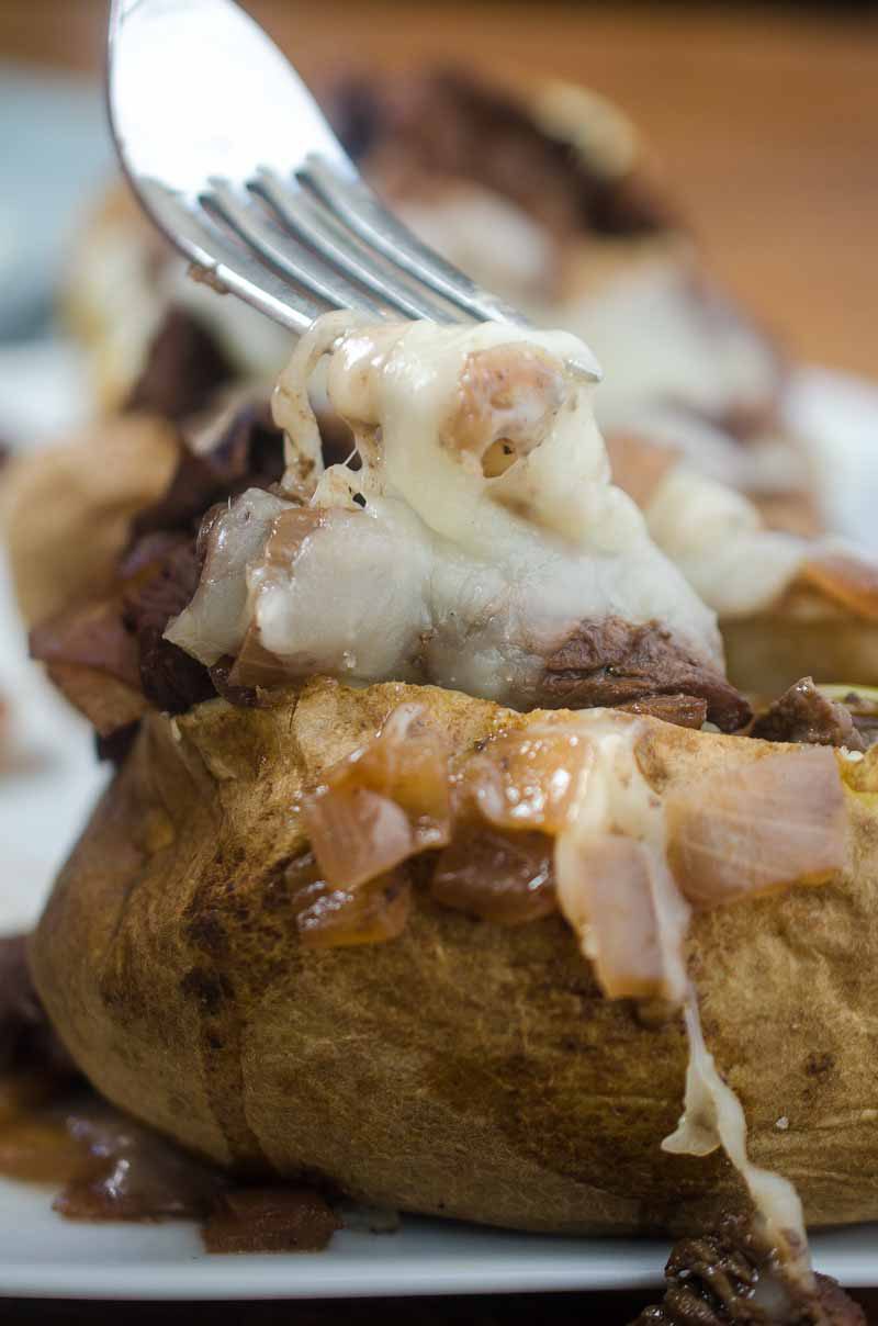 Make baked potatoes a meal with these French-Style Beef Baked Potatoes. They are loaded with thinly slice top sirloin, caramelized onion sauce and shredded Swiss cheese.