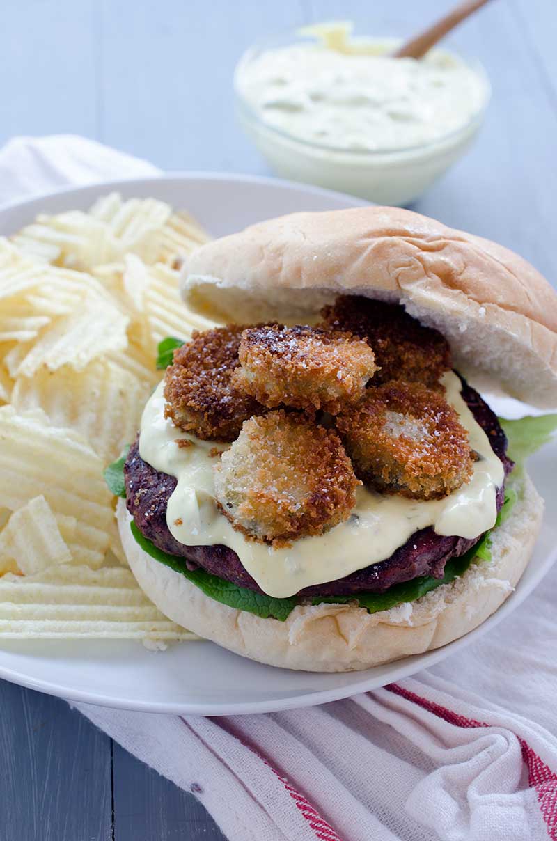 When it comes to epic burgers this Fried Pickle Burger loaded with spicy fried pickles and homemade burger spread is at the top of the list.