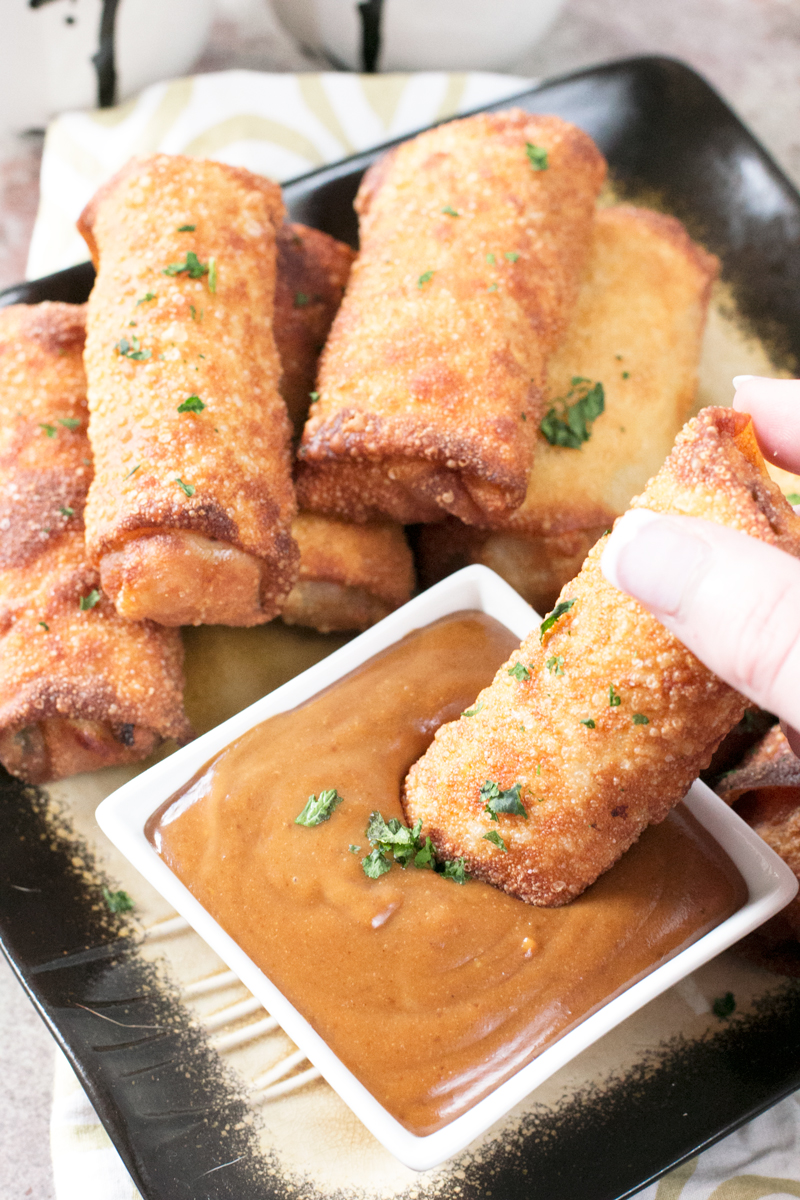 Crispy fried shrimp egg rolls loaded with shrimp, veggies and dipped in a spicy peanut sauce. 