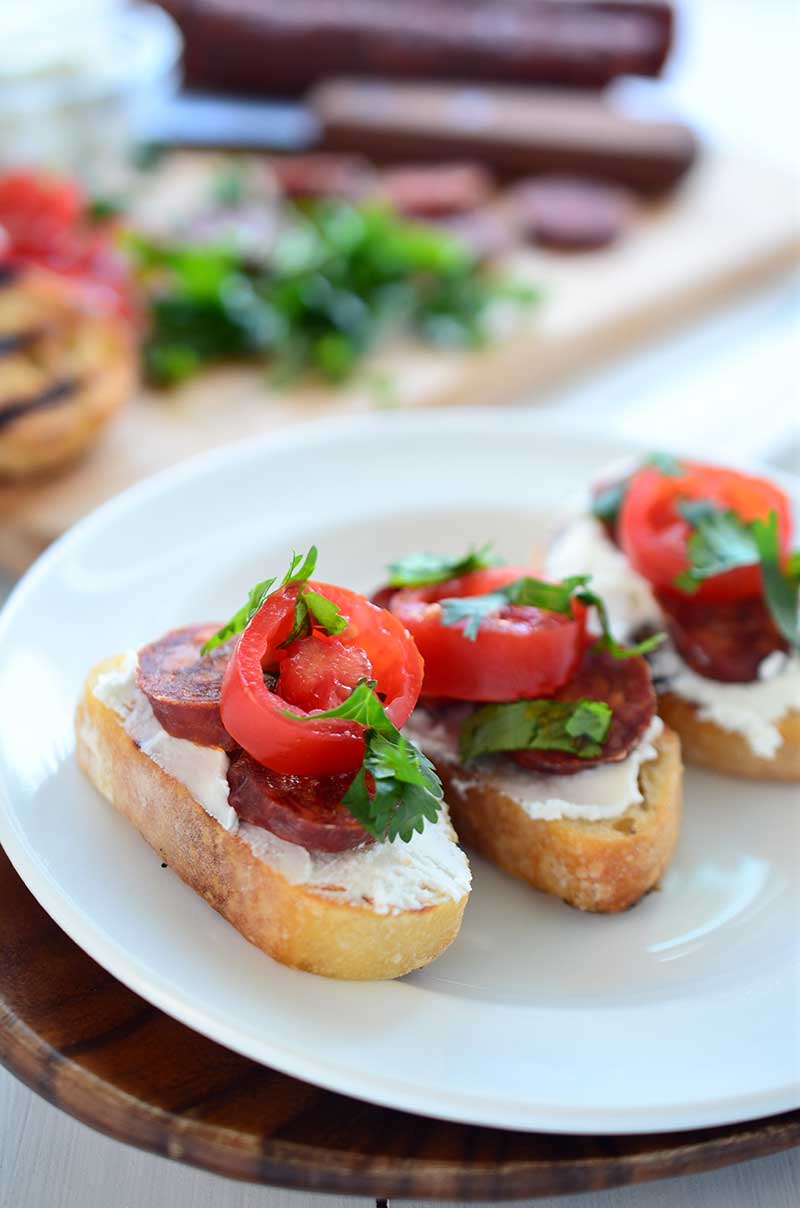 If you are looking for the perfect quick and easy appetizer for summer parties this Goat Cheese and Chorizo Crostini is it.