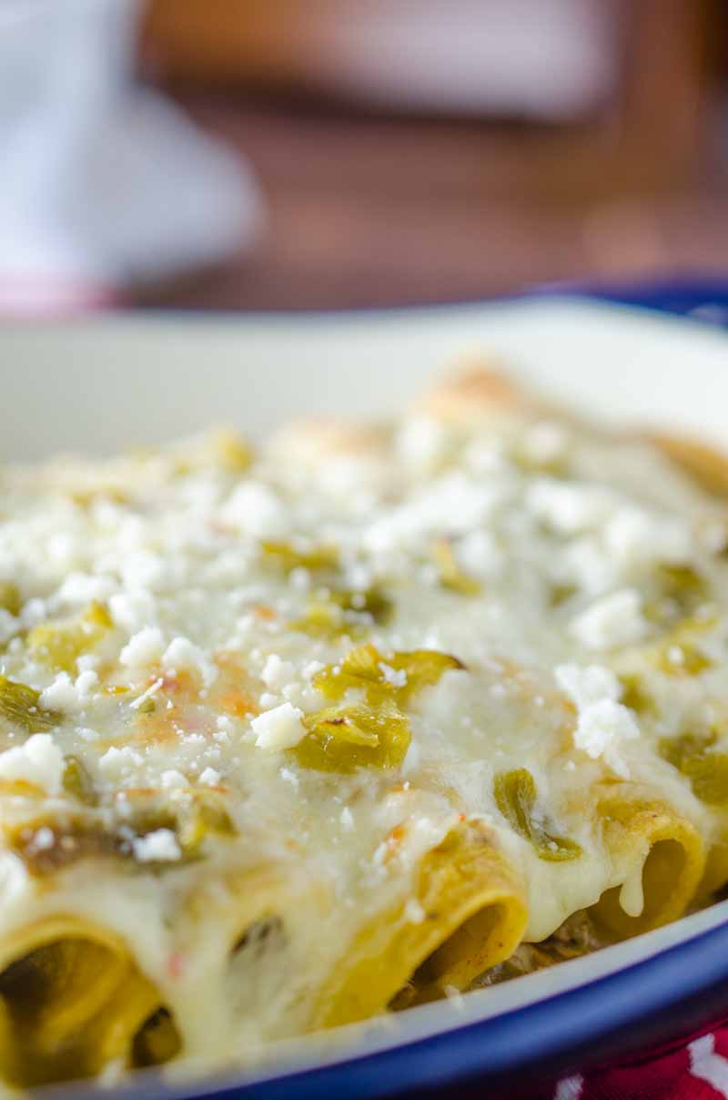 Green Chile Chicken Enchiladas are loaded with chicken, chiles and 3 kinds of cheese. They are perfect way to use leftover chicken.