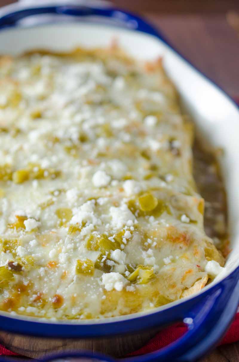 Green Chile Chicken Enchiladas are loaded with chicken, chiles and 3 kinds of cheese. They are perfect way to use leftover chicken. 