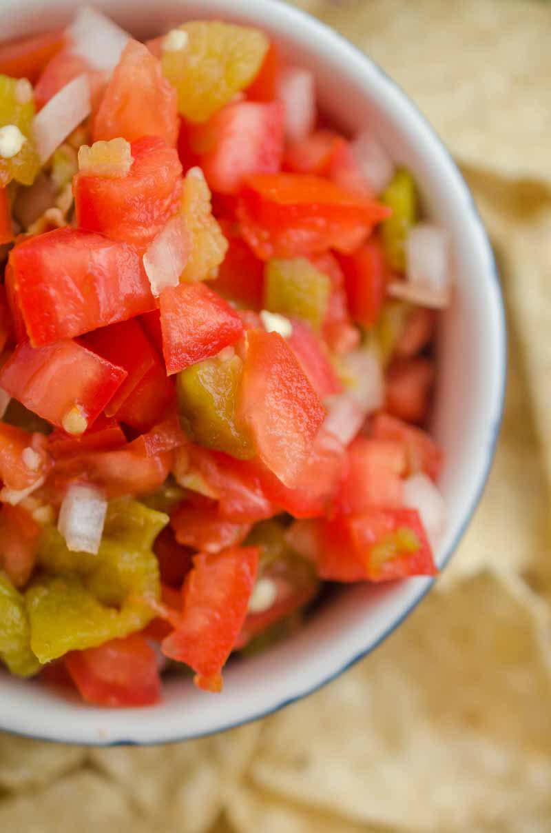 Hatch Chile Salsa Fresca is made with roasted hatch chilies, fresh tomatoes, onions, garlic and lime. It's a fun twist on fresh salsa!
