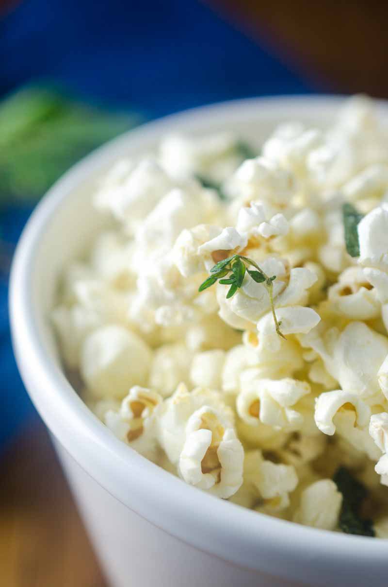 Want to jazz up everyone's favorite movie snack? Butter fried sage and thyme make this Herb Butter Popcorn perfect for movie night. 