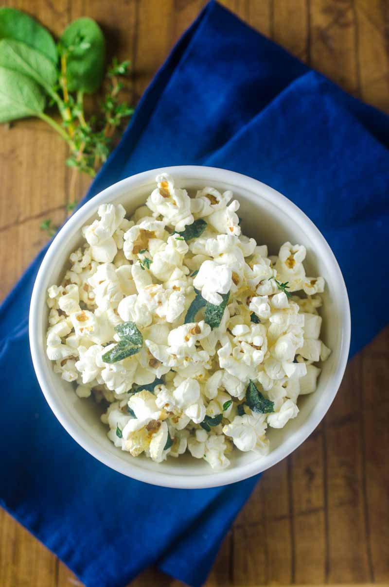 Want to jazz up everyone's favorite movie snack? Butter fried sage and thyme make this Herb Butter Popcorn perfect for movie night. 