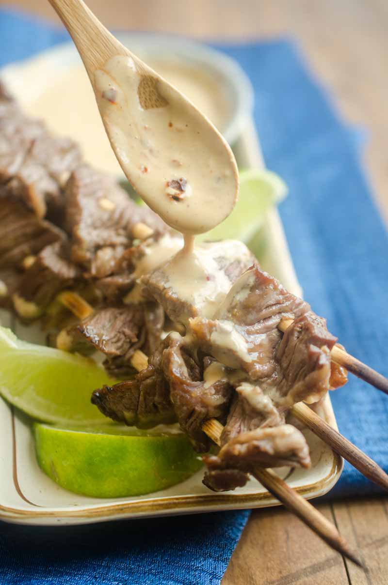 Hoisin Marinated Beef Skewers with Peanut Sauce are a family favorite. Sweet hoisin, tender beef and a creamy peanut sauce make them a flavor bomb! 