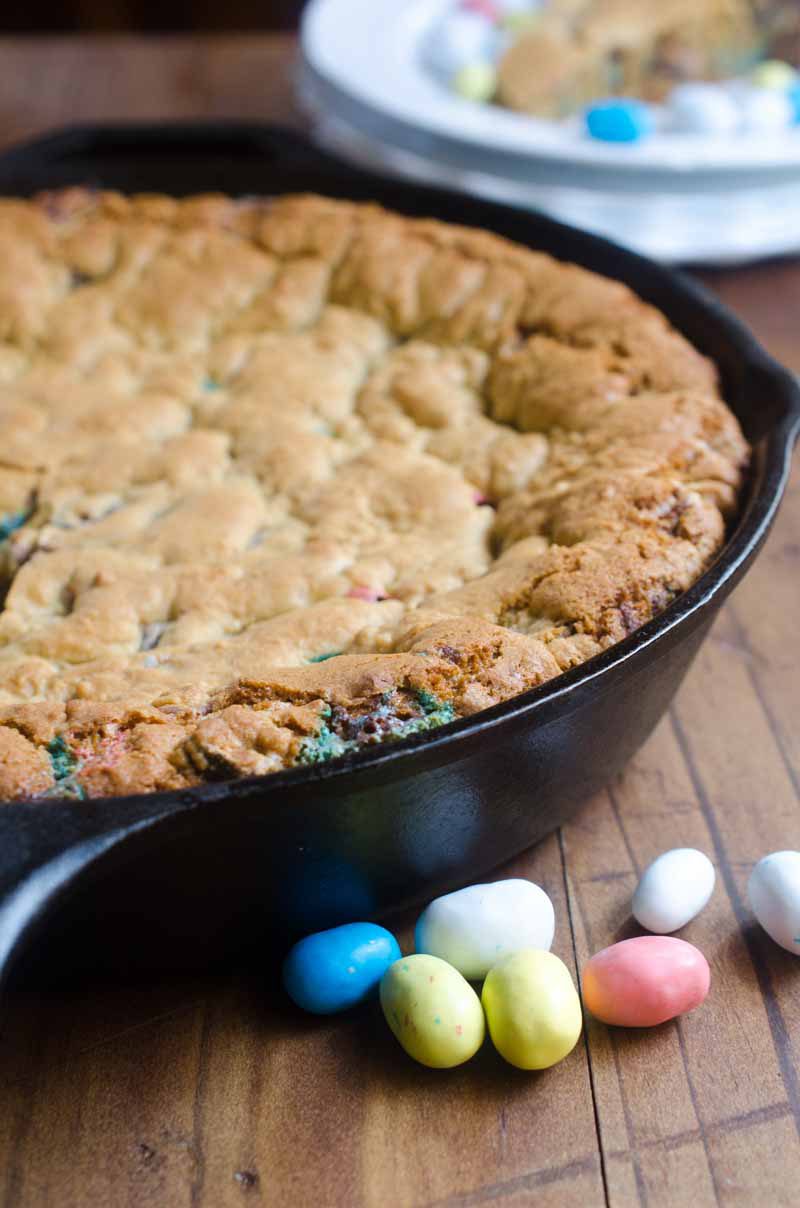 What's better than Easter candy? A big ol' Easter Candy Skillet Cookie! This Easter Skillet Cookie is loaded with chocolate chips, malted milk and malted robin eggs.