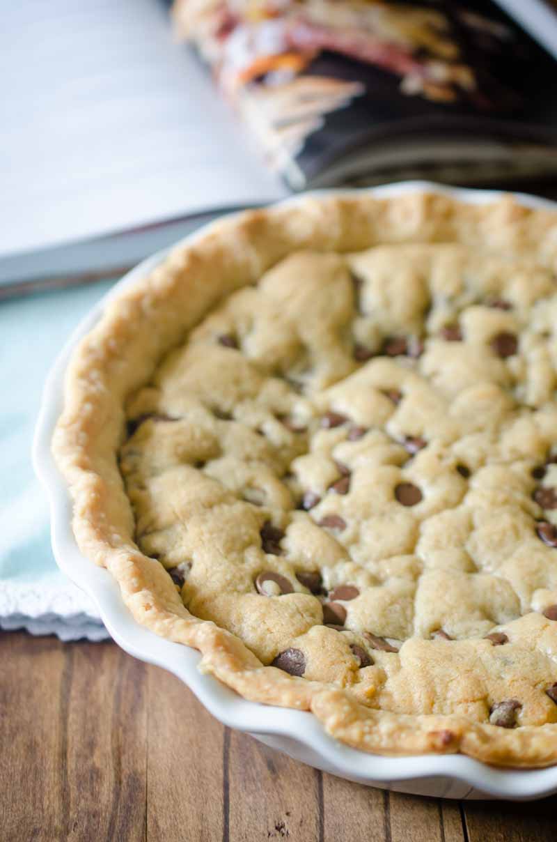 Million Dollar Cookie Pie is a decadent dessert with a layer of pie crust, chocolate hazelnut spread, Dulce de Leche and chocolate chip cookie dough.