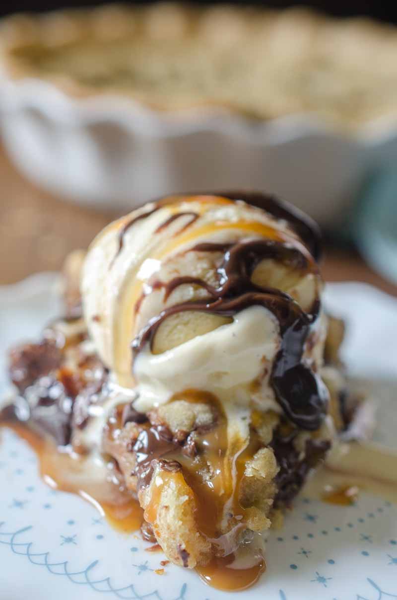 Million Dollar Cookie Pie is a decadent dessert with a layer of pie crust, chocolate hazelnut spread, Dulce de Leche and chocolate chip cookie dough.