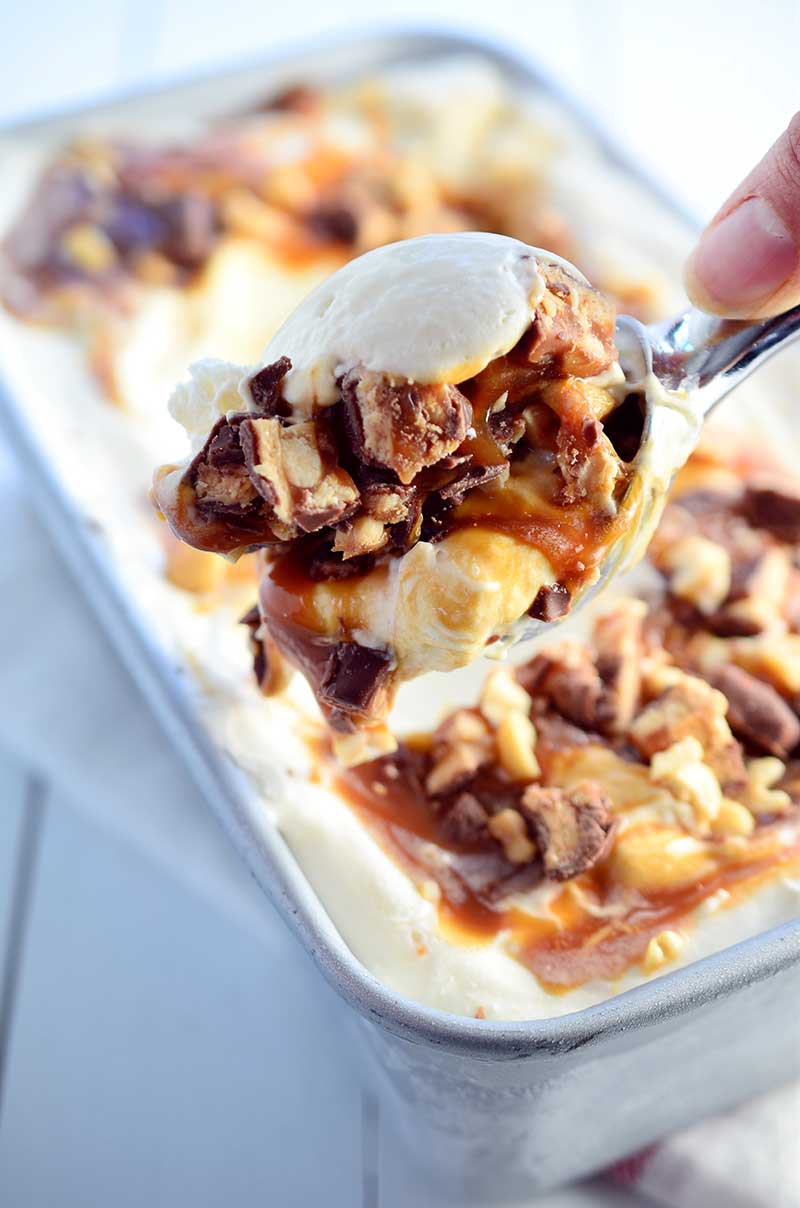 No Churn Snickers Ice Cream is a rich decadent treat loaded with chopped Snickers candies, caramel sauce and chopped peanuts. And it is beyond easy to make! 