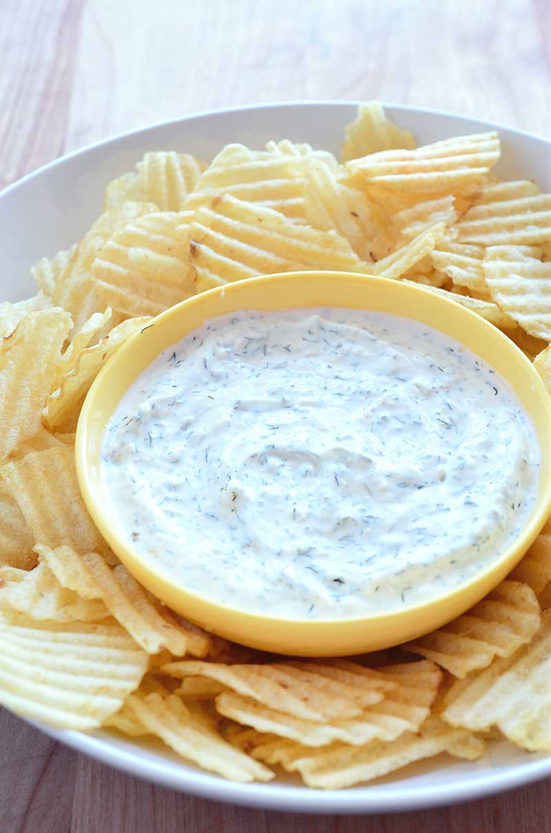 Quick, easy and light this Parmesan Ranch dip made with greek yogurt, mayonnaise, dill and garlic is the perfect dip for all your potluck parties! 