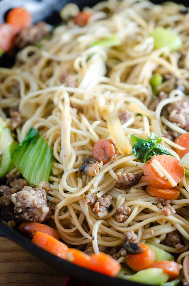 A quick and easy pork and veggie stir fry with ground pork, carrots, baby bok choy, onions and mushrooms.