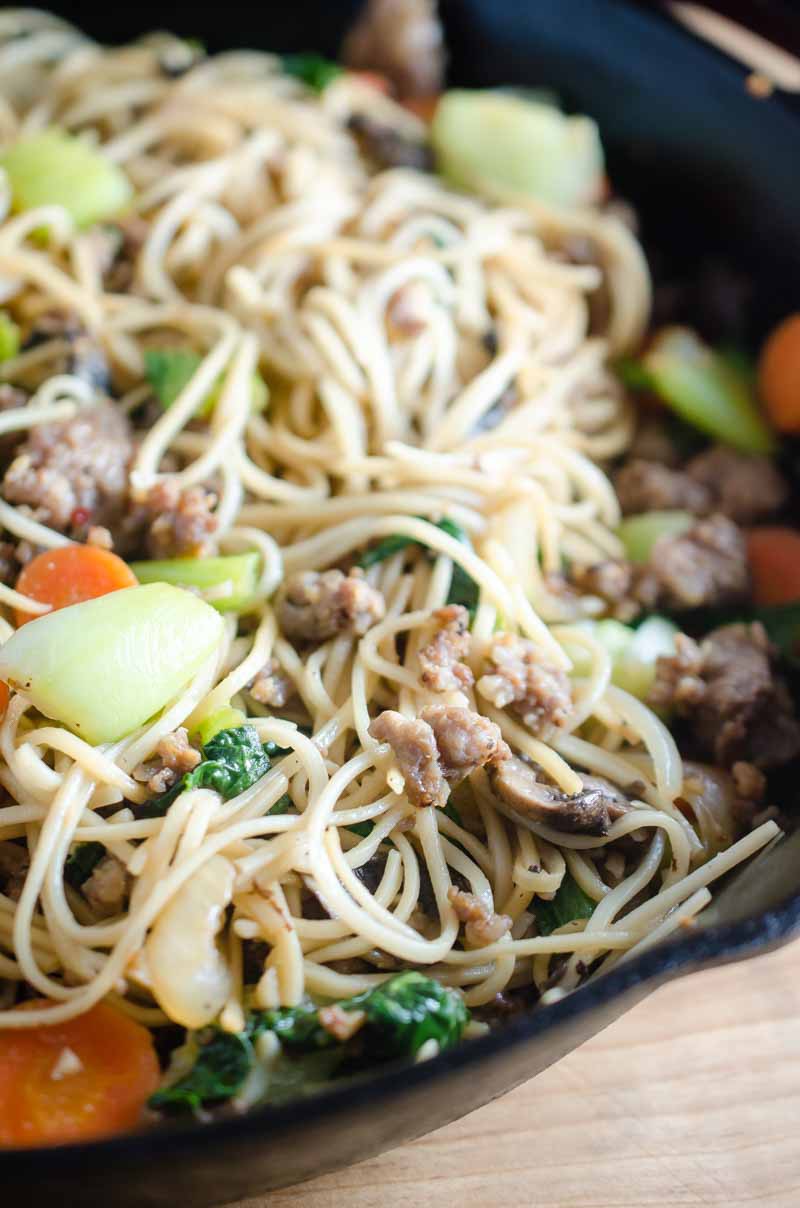 A quick and easy pork and veggie stir fry with ground pork, carrots, baby bok choy, onions and mushrooms.