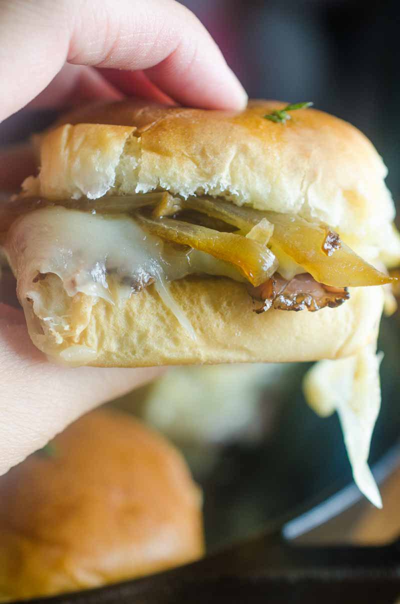 Quick and easy Roast Beef Mushroom Sliders are perfect for weeknights and game day! Loaded with roast beef, Swiss cheese, sautéed mushrooms and brushed with herb butter.