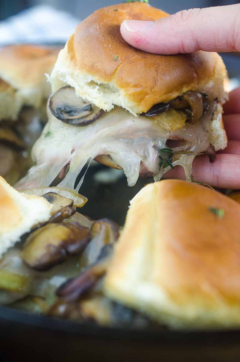 Quick and easy Roast Beef Mushroom Sliders are perfect for weeknights and game day! Loaded with roast beef, Swiss cheese, sautéed mushrooms and brushed with herb butter.
