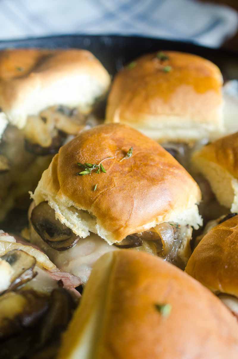 Quick and easy Roast Beef Mushroom Sliders are perfect for weeknights and game day! Loaded with roast beef, Swiss cheese, sautéed mushrooms and brushed with herb butter.