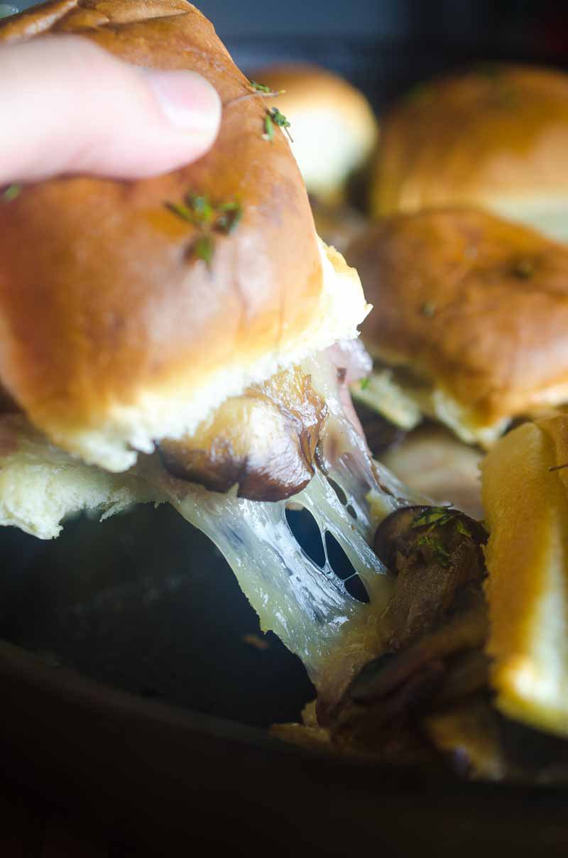 Quick and easy Roast Beef Mushroom Sliders are perfect for weeknights and game day! Loaded with roast beef, Swiss cheese, sautéed mushrooms and brushed with herb butter.