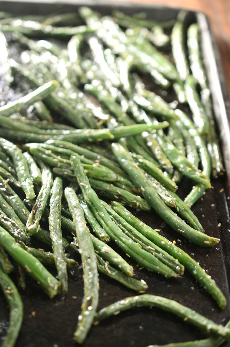Rosemary roasted green beans are the perfect twist to a classic holiday meal side dish.