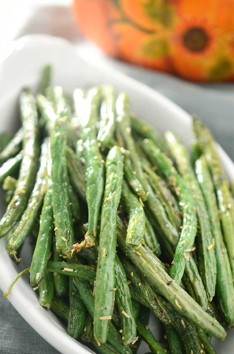 Rosemary roasted green beans are the perfect twist to a classic holiday meal side dish.