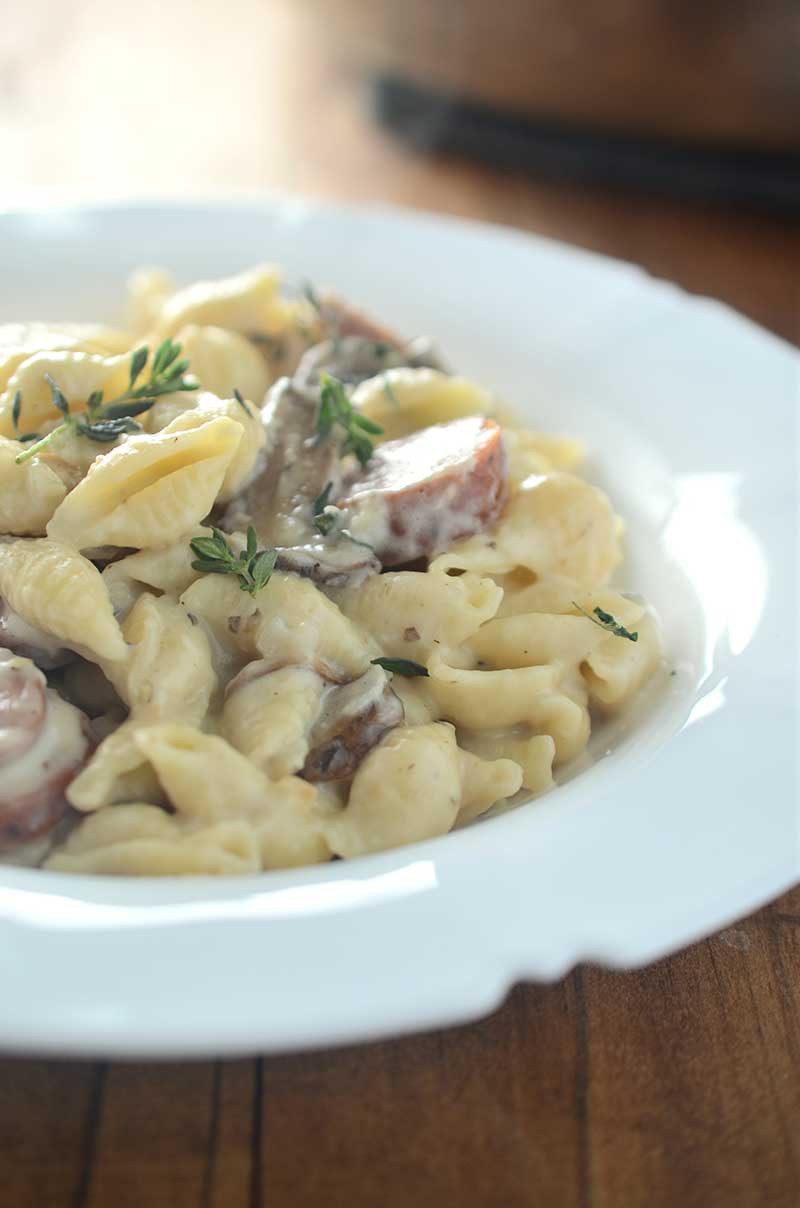 Dinner doesn't get more comforting than this Sausage and Mushroom Mac n' Cheese. This pasta is loaded with smoky sausage, mushrooms, swiss cheese and thyme. It's the perfect fall dinner! 