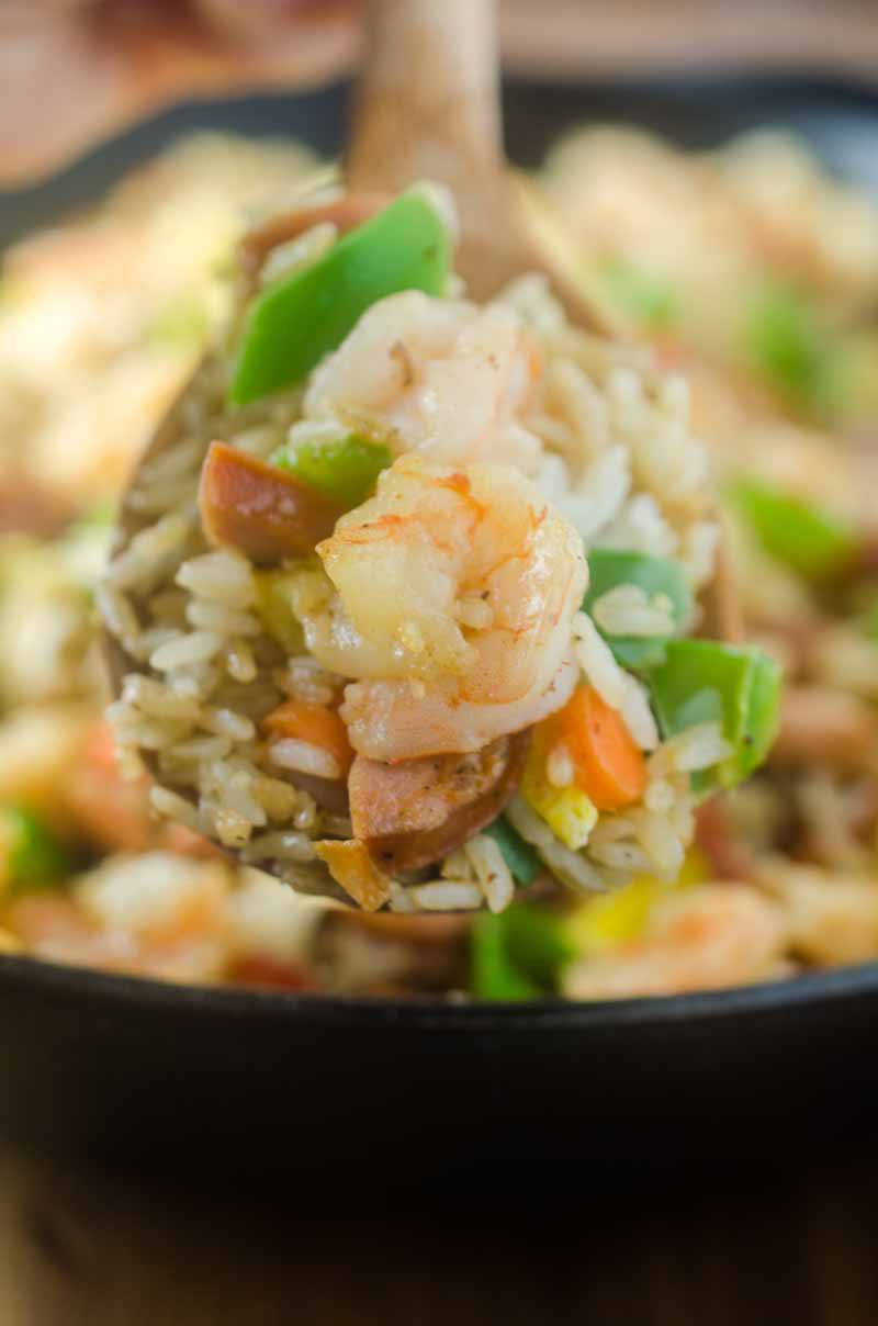 Andouille and Shrimp Fried Rice is loaded with all kinds of goodies! Spicy andouille, succulent shrimp, eggs, bacon and veggies. 