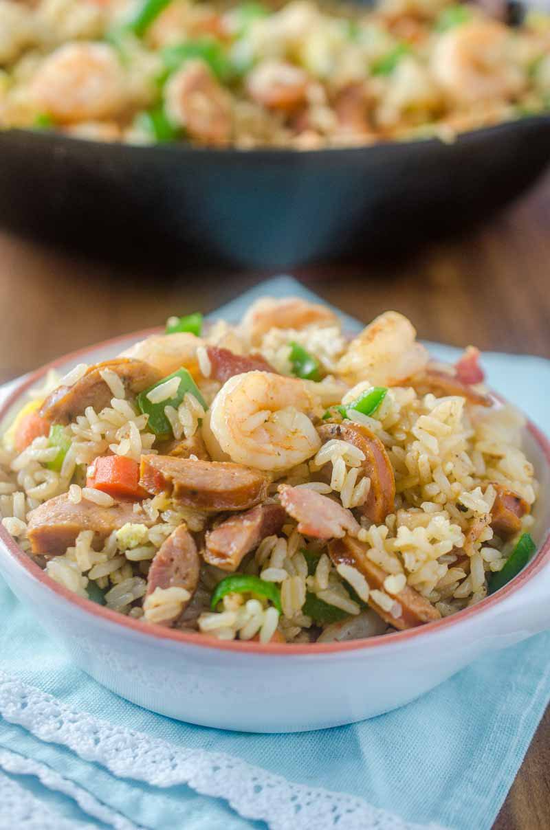 Andouille and Shrimp Fried Rice is loaded with all kinds of goodies! Spicy andouille, succulent shrimp, eggs, bacon and veggies.