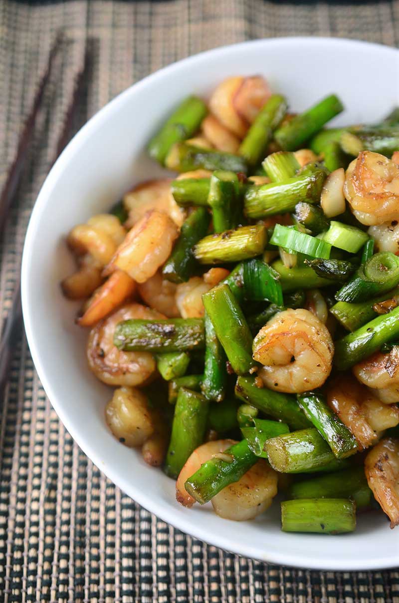 Welcoming asparagus season with this quick and easy Shrimp and Asparagus Stir Fry. It's perfect for weeknights and a total crowd pleaser. 