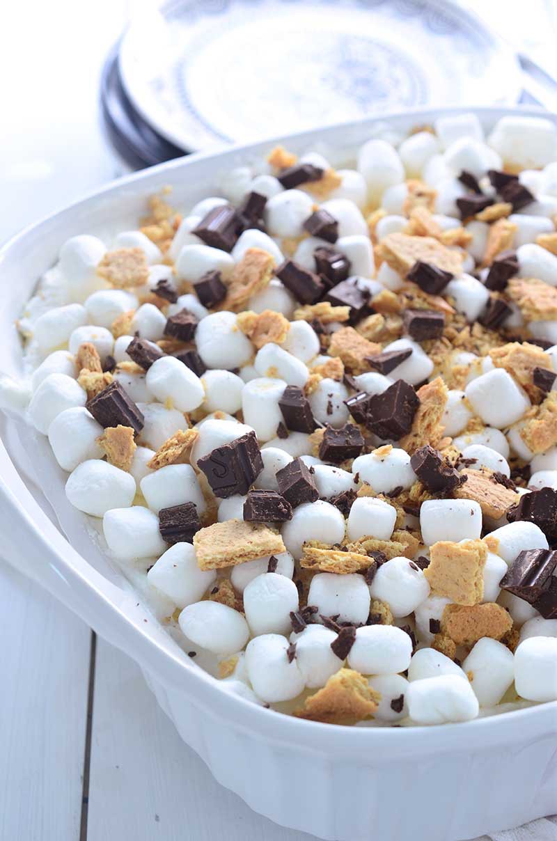 S'mores Oreo Icebox Cake is a THEE dessert that you need to be making this summer. Loaded with s'mores oreos, whipped cream, marshmallows, graham crackers and chocolate.