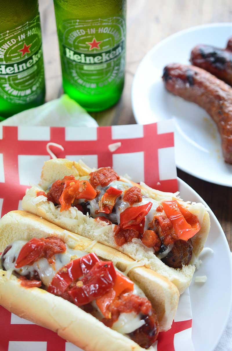 Spicy Italian Sausage Dogs topped with mozzarella, marinara and spicy peppers are the perfect spicy grilled meal this summer.