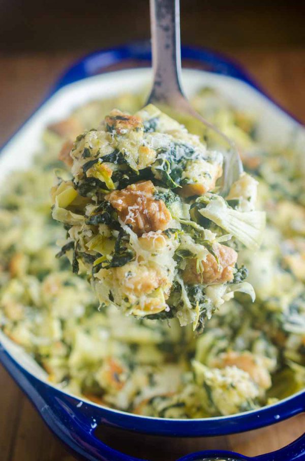 Spinach Artichoke Stuffing is a mashup of everyone's favorite party dip and everyone's favorite Thanksgiving side. It's loaded with spinach, artichokes and parmesan cheese. It's a must for your holiday table!