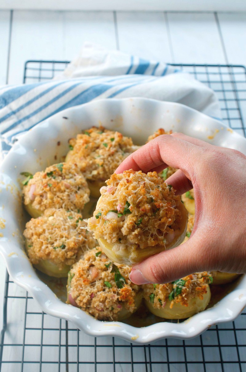 These stuffed artichoke bottoms are stuffed with parmesan, chopped clams, shallots and breadcrumbs. They are the perfect bite for holiday parties!