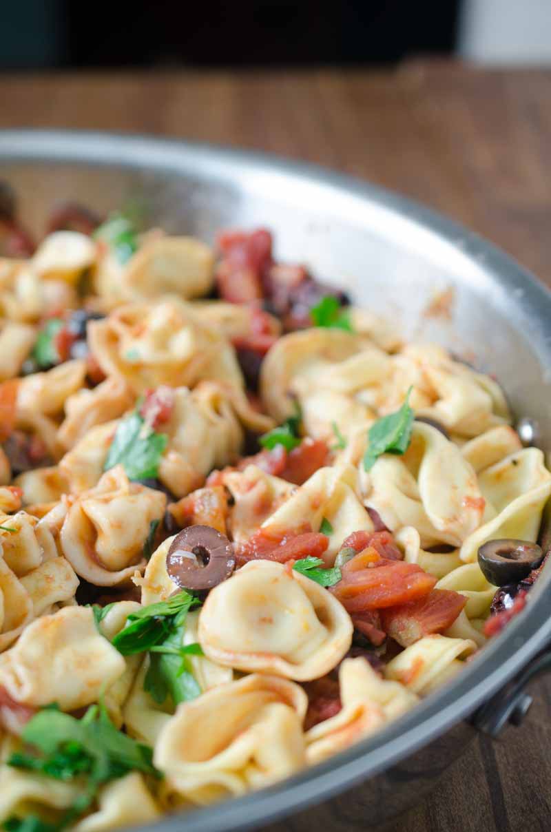 Tortellini Puttanesca is loaded with tomatoes, olives, capers, garlic and red wine. It is a family hit that will make weeknight dinners a breeze!