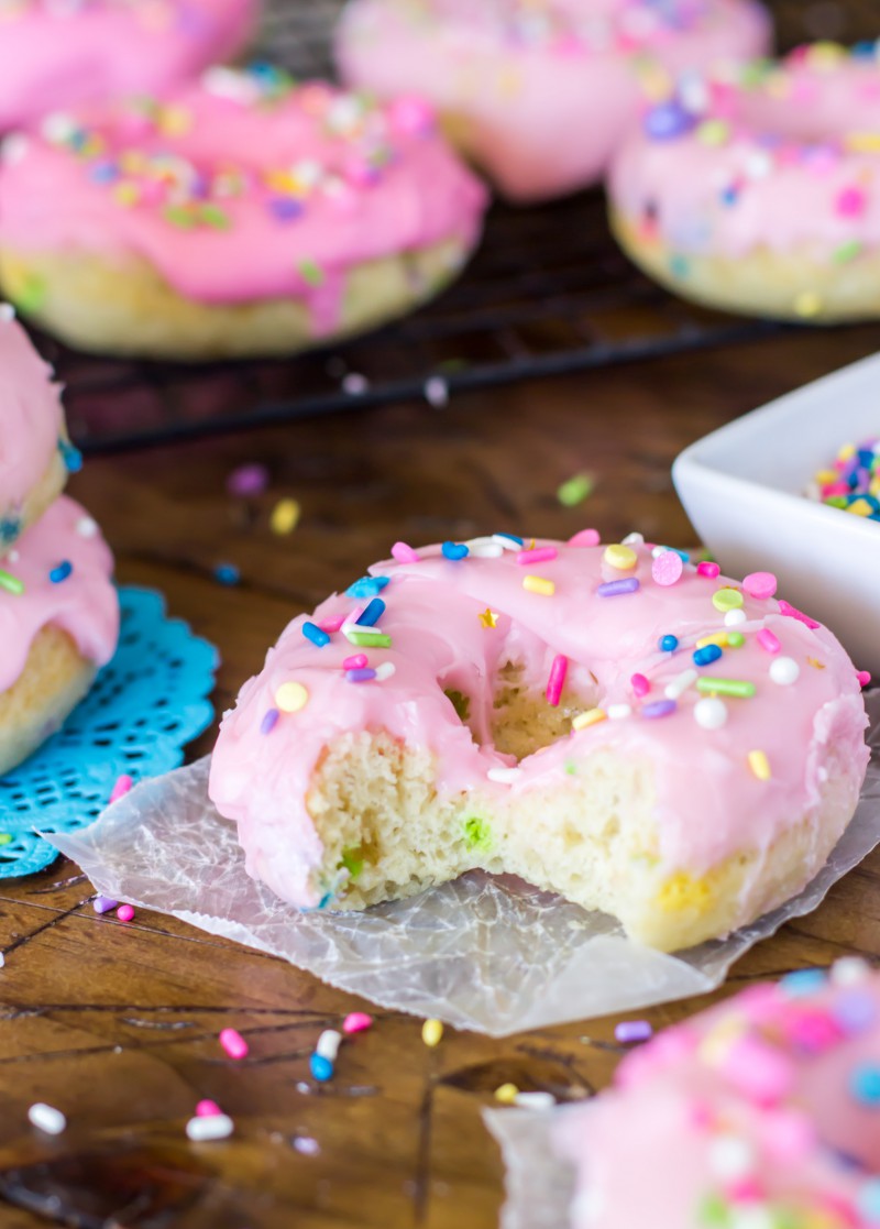 These Baked Funfetti Doughnuts are light, fluffy, crammed with sprinkles, and covered in a pretty pink glaze (and more sprinkles!)
