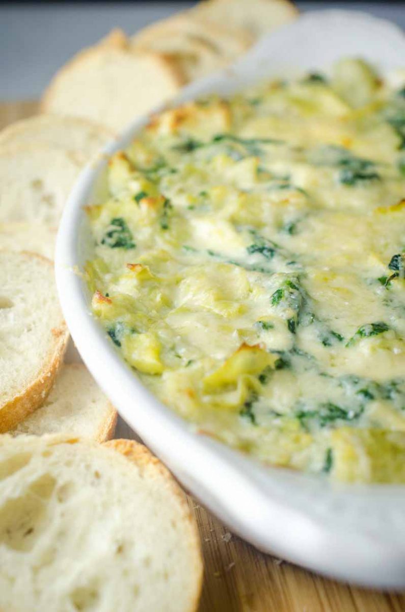 Decadent Hot Crab Spinach Artichoke Dip is a must for parties this season! If you love spinach artichoke dip, you will love this version with crab! 