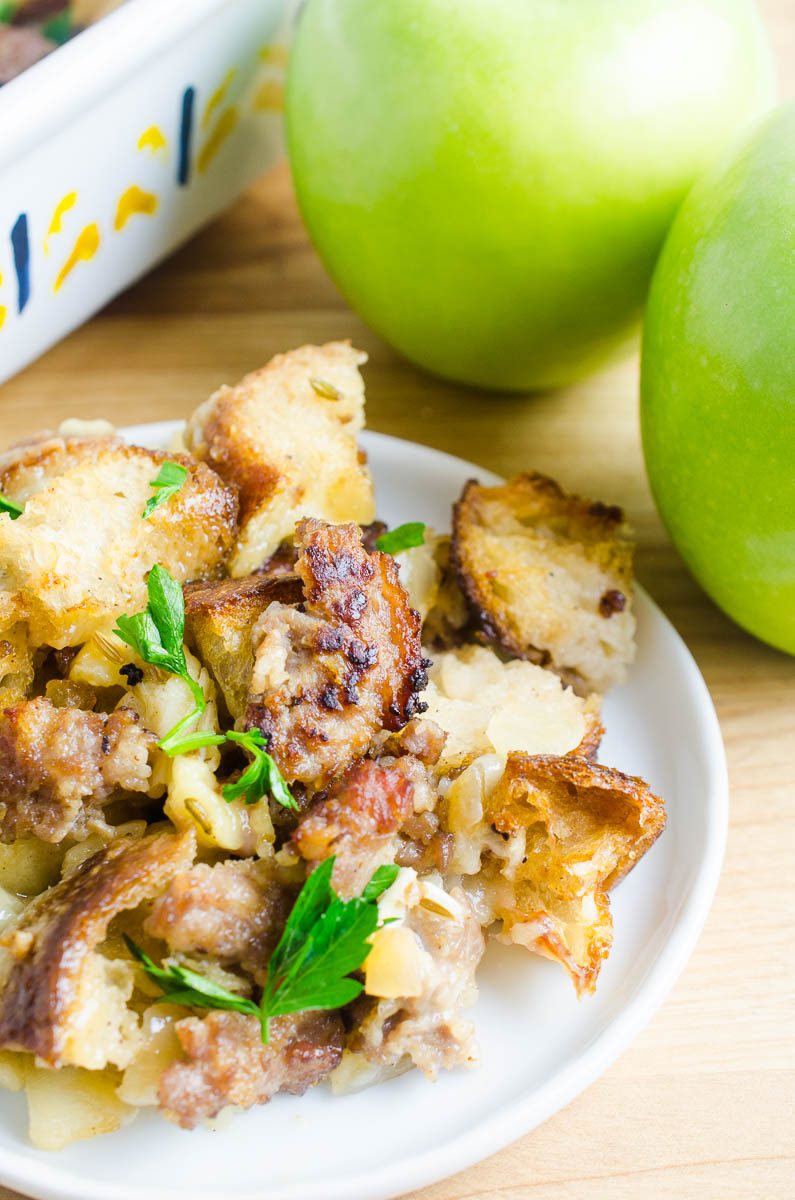 Sausage apple stuffing with brie on a plate. 