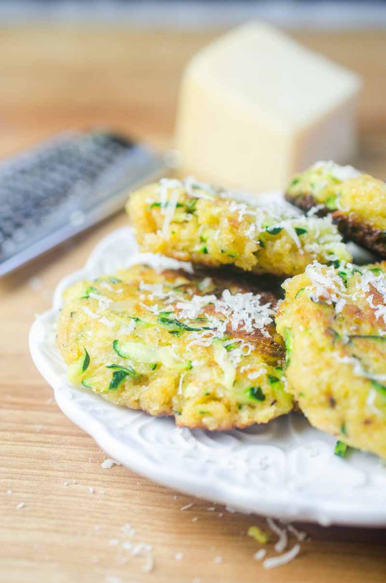 Zucchini cakes made with fresh zucchini, cheese, and spices blended together and fried until golden. A great way to use up that garden zucchini!