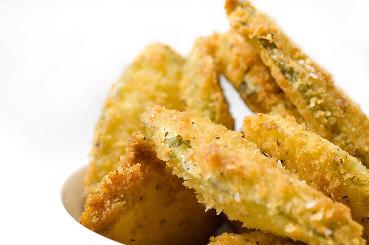This Deep Fried Pickles Recipe is the perfect recipe for pickle fanatics. The pickles are coated in panko bread crumbs and fried until golden. 