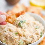 Pita chip scooping Cold Crab Dip.