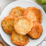 Fried Tomatillos on a white plate.