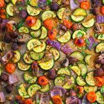 Roasted vegetables on a baking sheet.